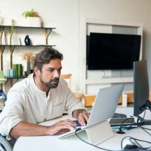 Guy reviewing Federal Davis-Bacon Contractors Guide FAQ's.
